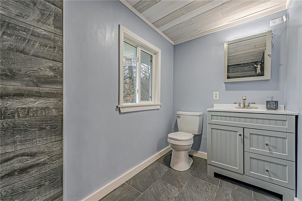 2087 White Cloud Road Leechburg, PA 15656 - Photo 17 of 25 a bathroom with a toilet sink vanity and mirror