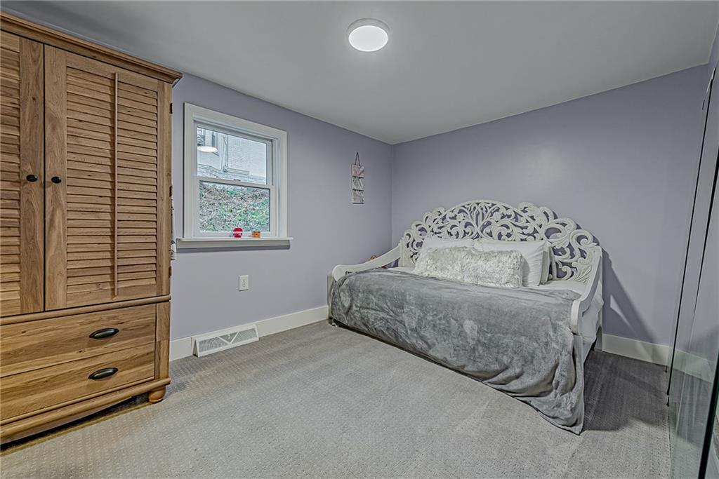 2087 White Cloud Road Leechburg, PA 15656 - Photo 18 of 25 a spacious bedroom with a bed and a window