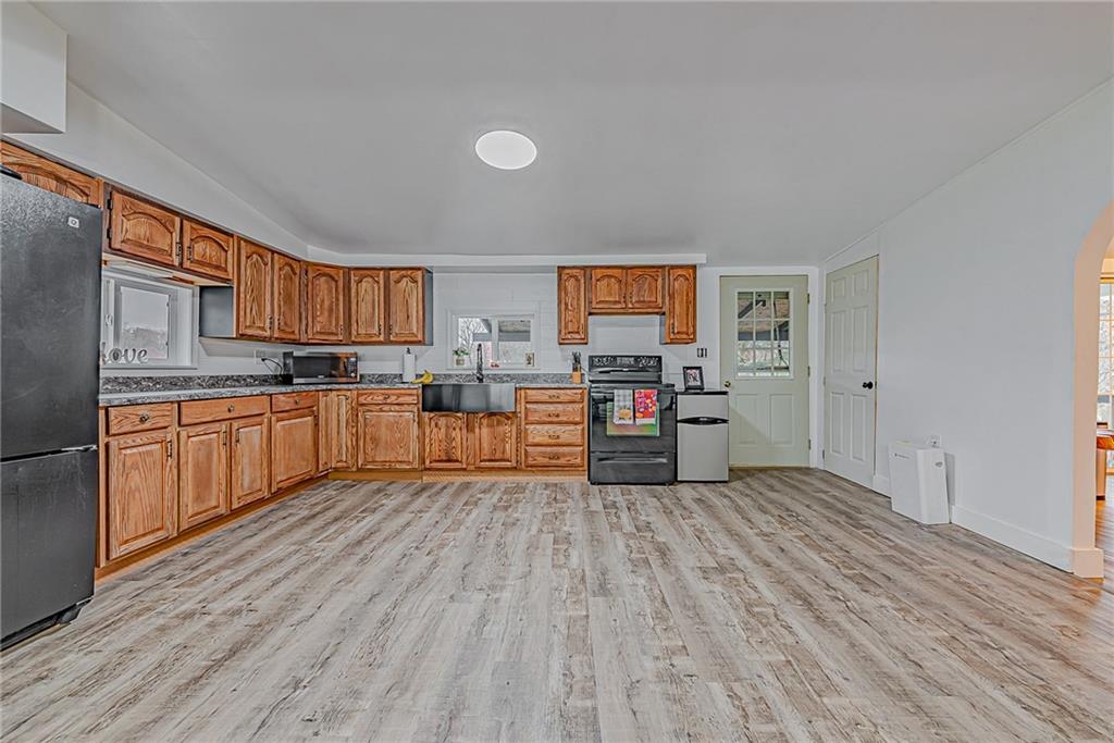 2087 White Cloud Road Leechburg, PA 15656 - Photo 9 of 25 a kitchen with stainless steel appliances kitchen island wooden cabinets and a refrigerator
