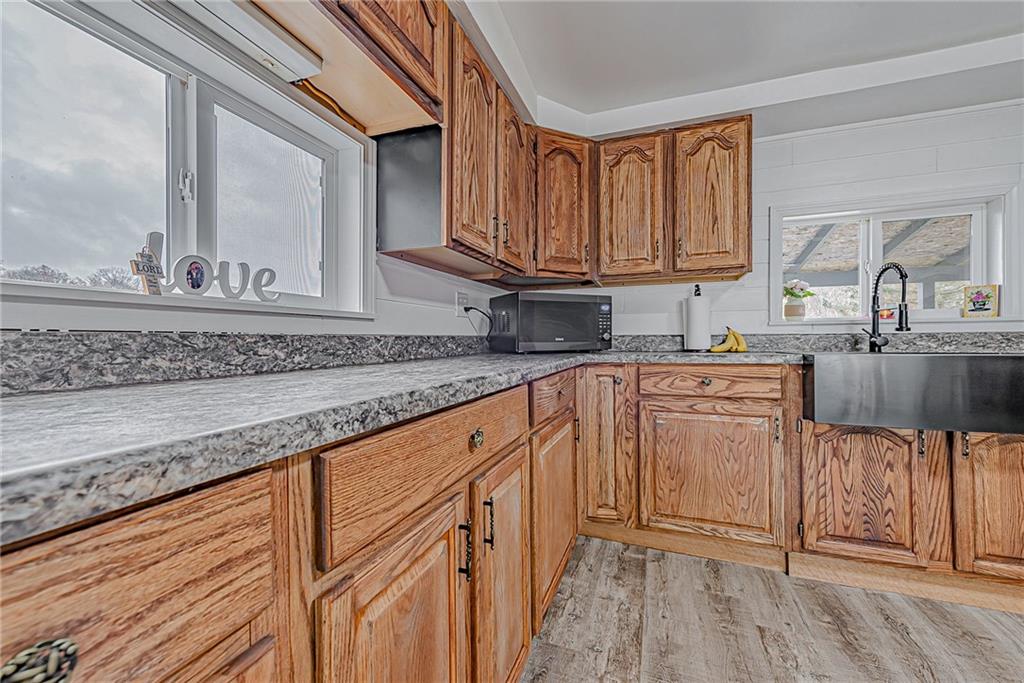 2087 White Cloud Road Leechburg, PA 15656 - Photo 10 of 25 a kitchen with stainless steel appliances granite countertop a sink stove and cabinets