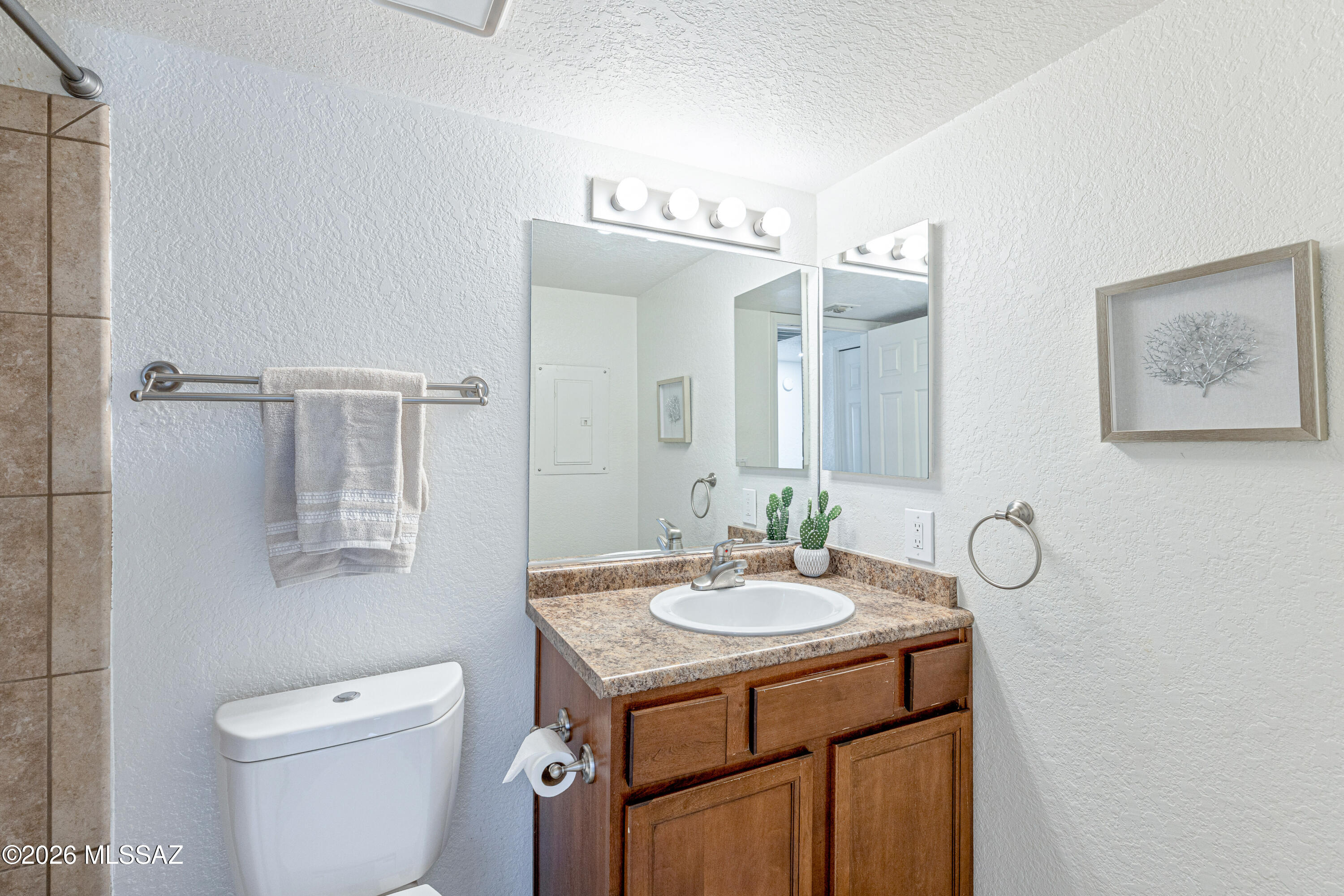 5800 North Kolb Road, Unit 1104 Tucson, AZ 85750 - Photo 18 of 29 Second bathroom has a combo tub/shower and is across the hall from bedroom number two.