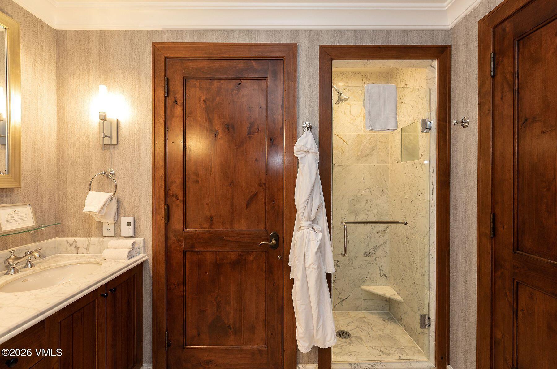 100 Bachelor Ridge Road, Unit 3208/04 Avon, CO 81620 - Photo 4 of 25 a bathroom with a sink and a mirror