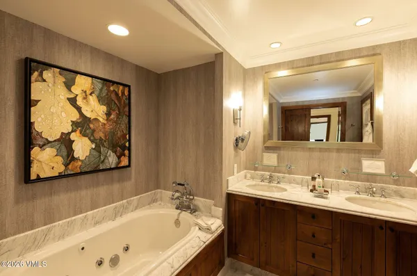 a bathroom with a sink mirror toilet and bathtub