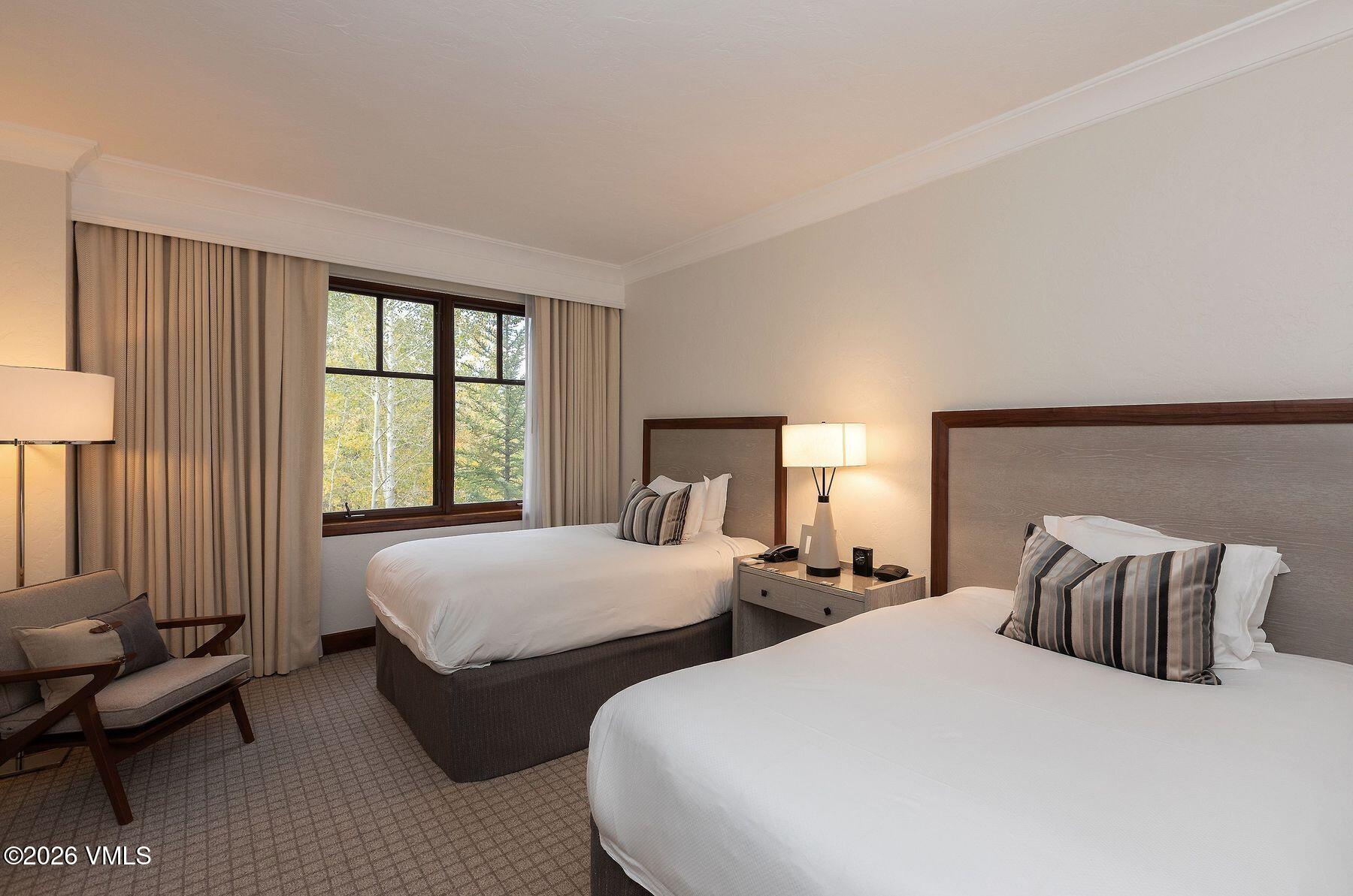 100 Bachelor Ridge Road, Unit 3208/04 Avon, CO 81620 - Photo 7 of 25 a bedroom with two beds and a couch