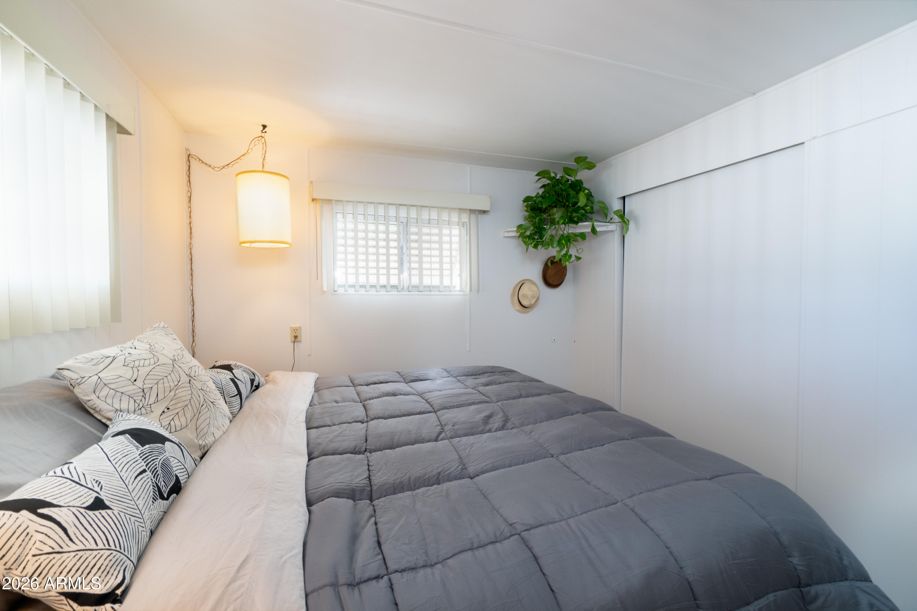 201 South Greenfield Road, Unit 361 Mesa, AZ 85206 - Photo 12 of 53 a bedroom with a bed and a window