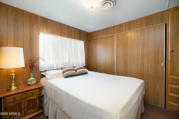 a bedroom with a bed and a dresser