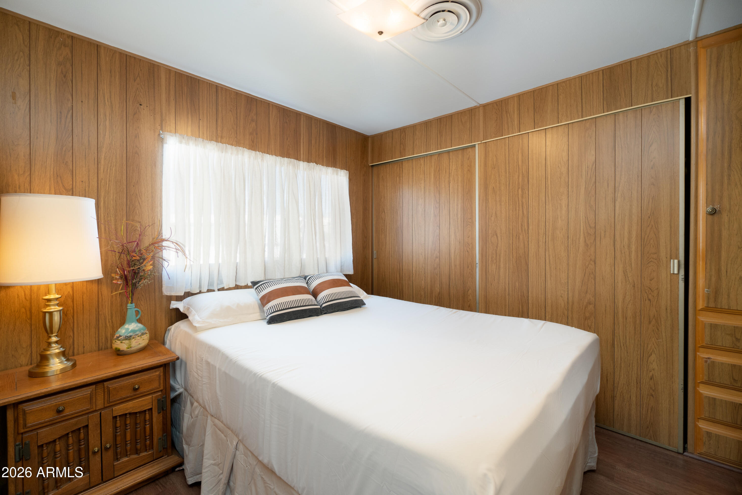 201 South Greenfield Road, Unit 361 Mesa, AZ 85206 - Photo 13 of 53 a bedroom with a bed and a dresser