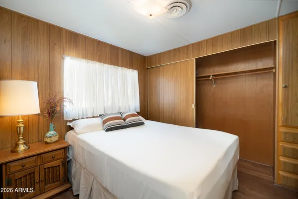 a bedroom with a bed and a dresser