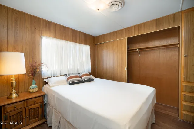 a bedroom with a bed and a dresser