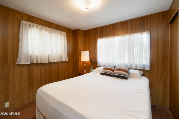 a bedroom with a bed and window