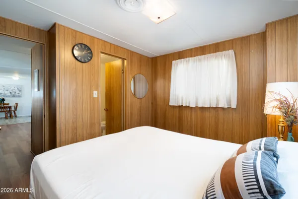 a bedroom with a bed and a window