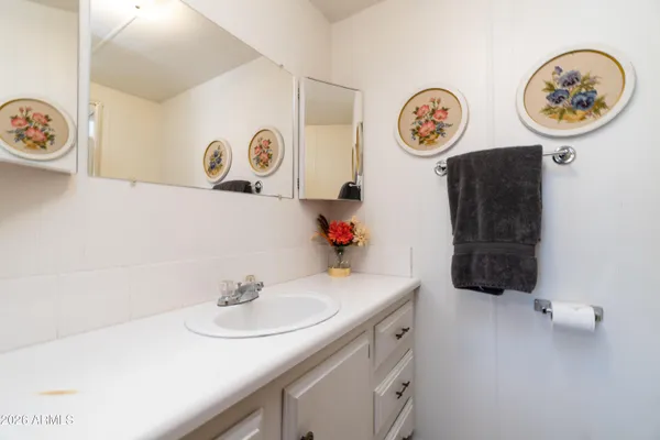 a kitchen with a refrigerator a sink and cabinets