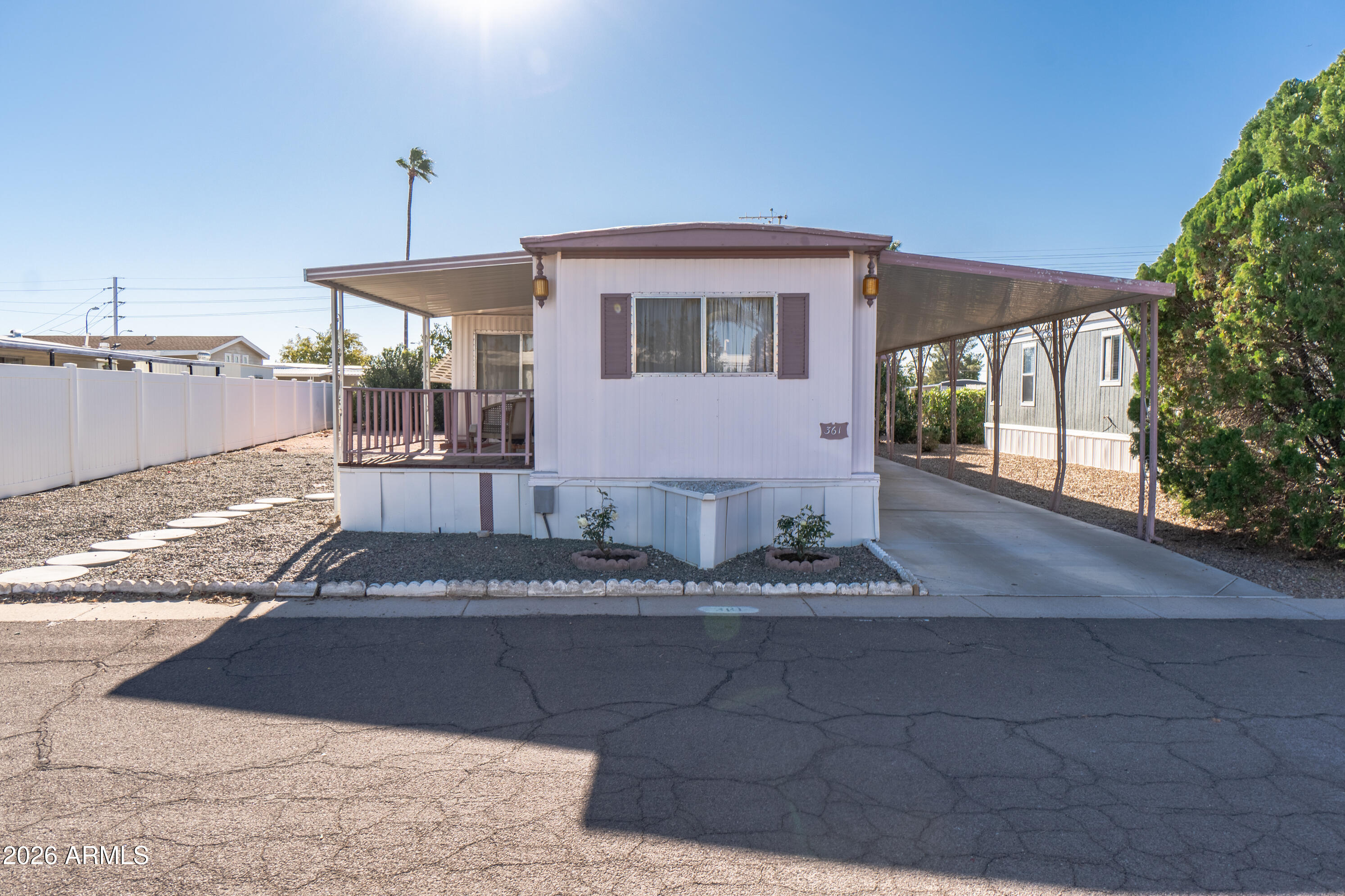 201 South Greenfield Road, Unit 361 Mesa, AZ 85206 - Photo 2 of 53 a front view of a house with garden