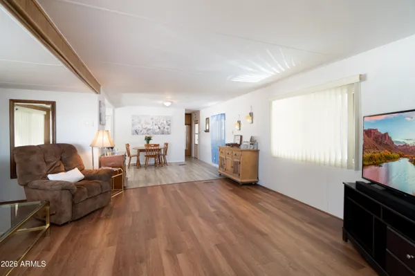 a view of a dining room with furniture and wooden floor