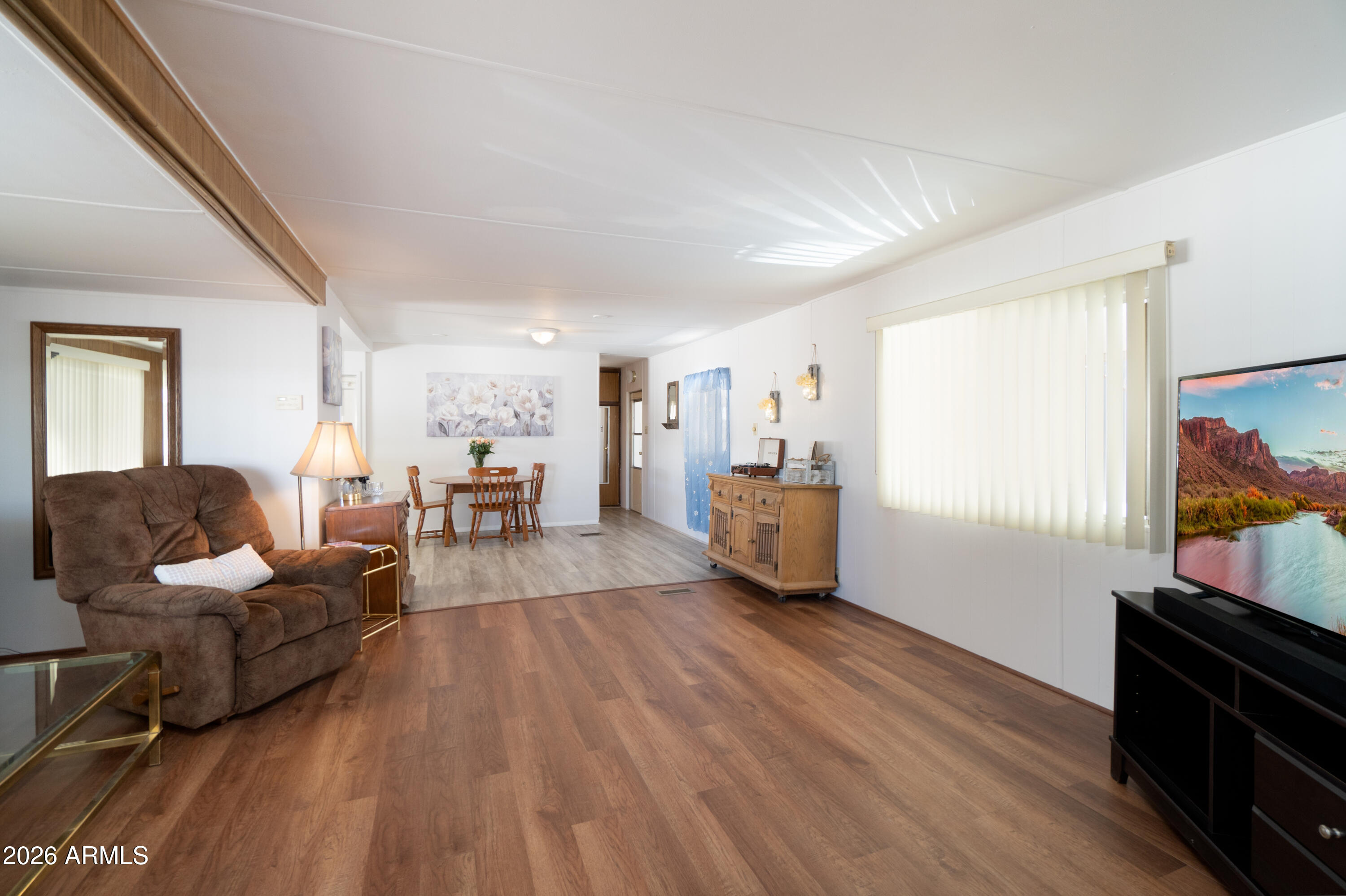 201 South Greenfield Road, Unit 361 Mesa, AZ 85206 - Photo 28 of 53 a living room with furniture and a flat screen tv