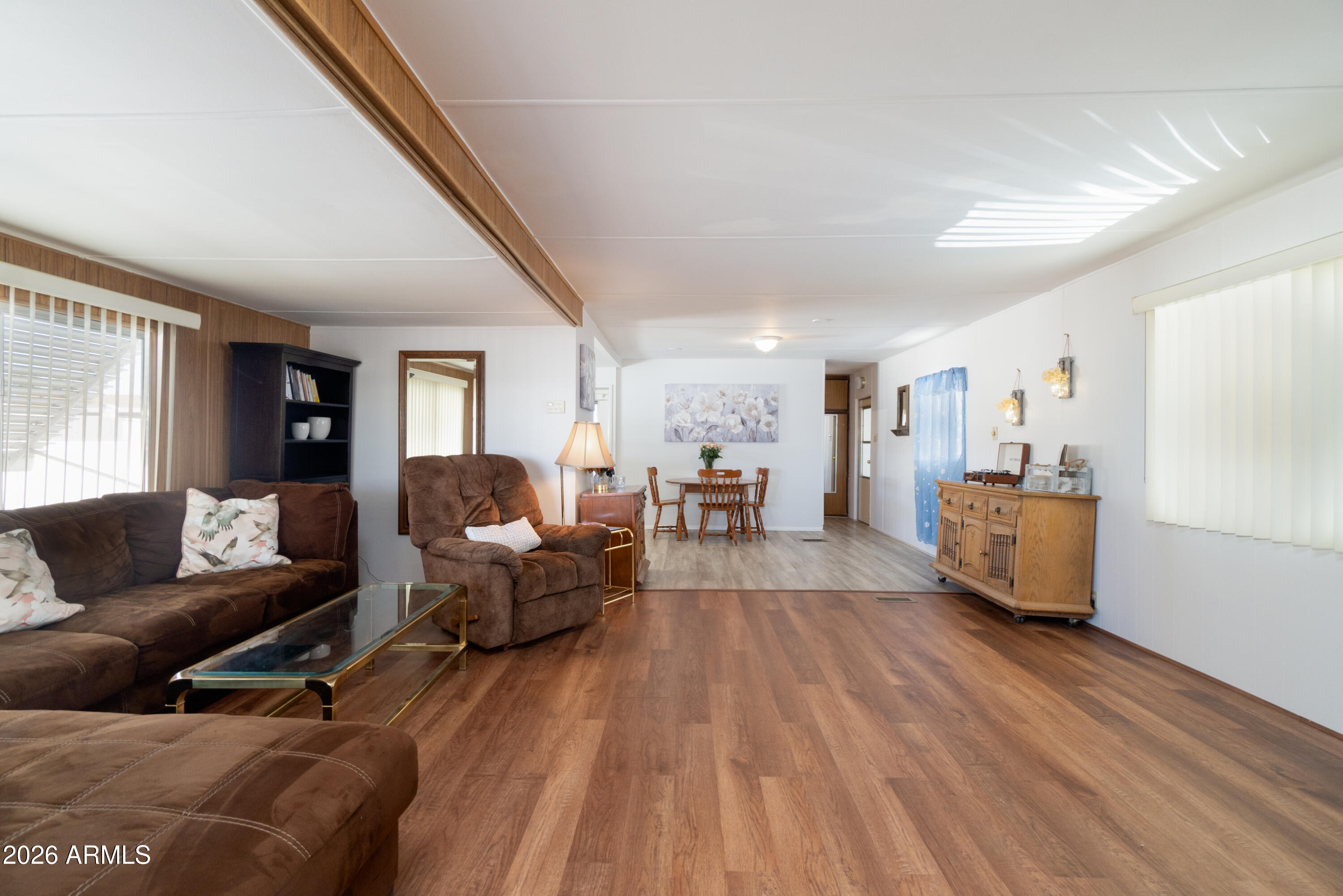 201 South Greenfield Road, Unit 361 Mesa, AZ 85206 - Photo 30 of 53 a living room with furniture and a wooden floor