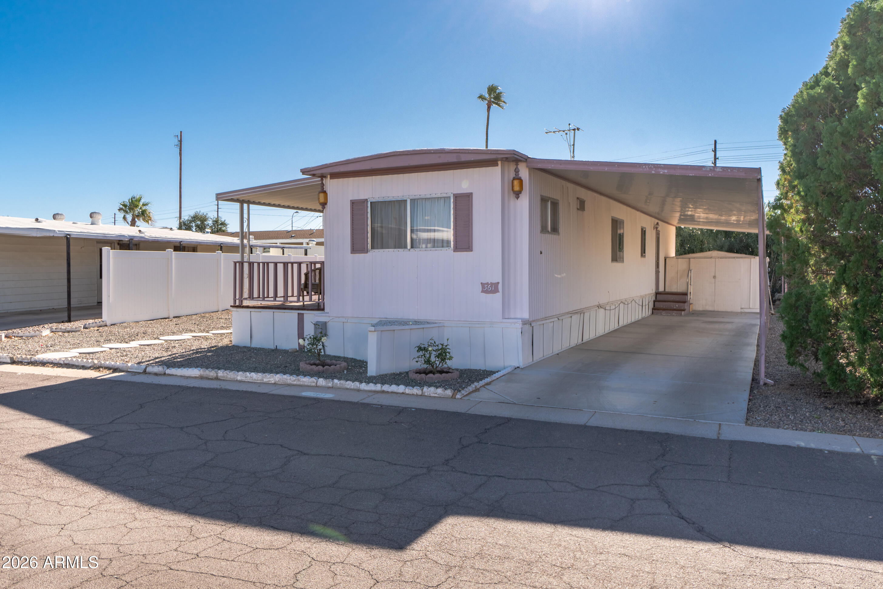 201 South Greenfield Road, Unit 361 Mesa, AZ 85206 - Photo 3 of 53 a front view of a house with a garage