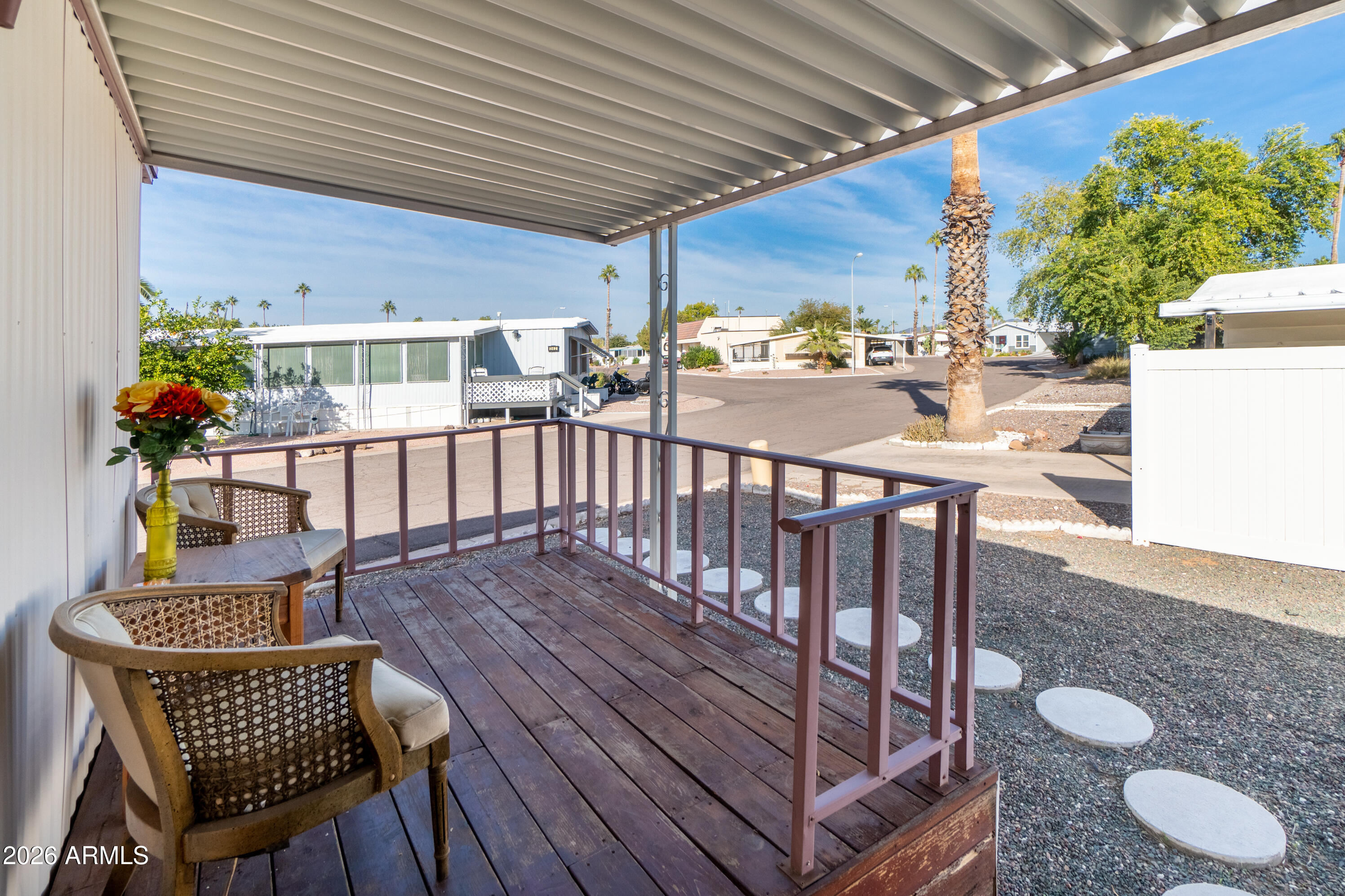 201 South Greenfield Road, Unit 361 Mesa, AZ 85206 - Photo 31 of 53 a view of a chairs and table in the patio