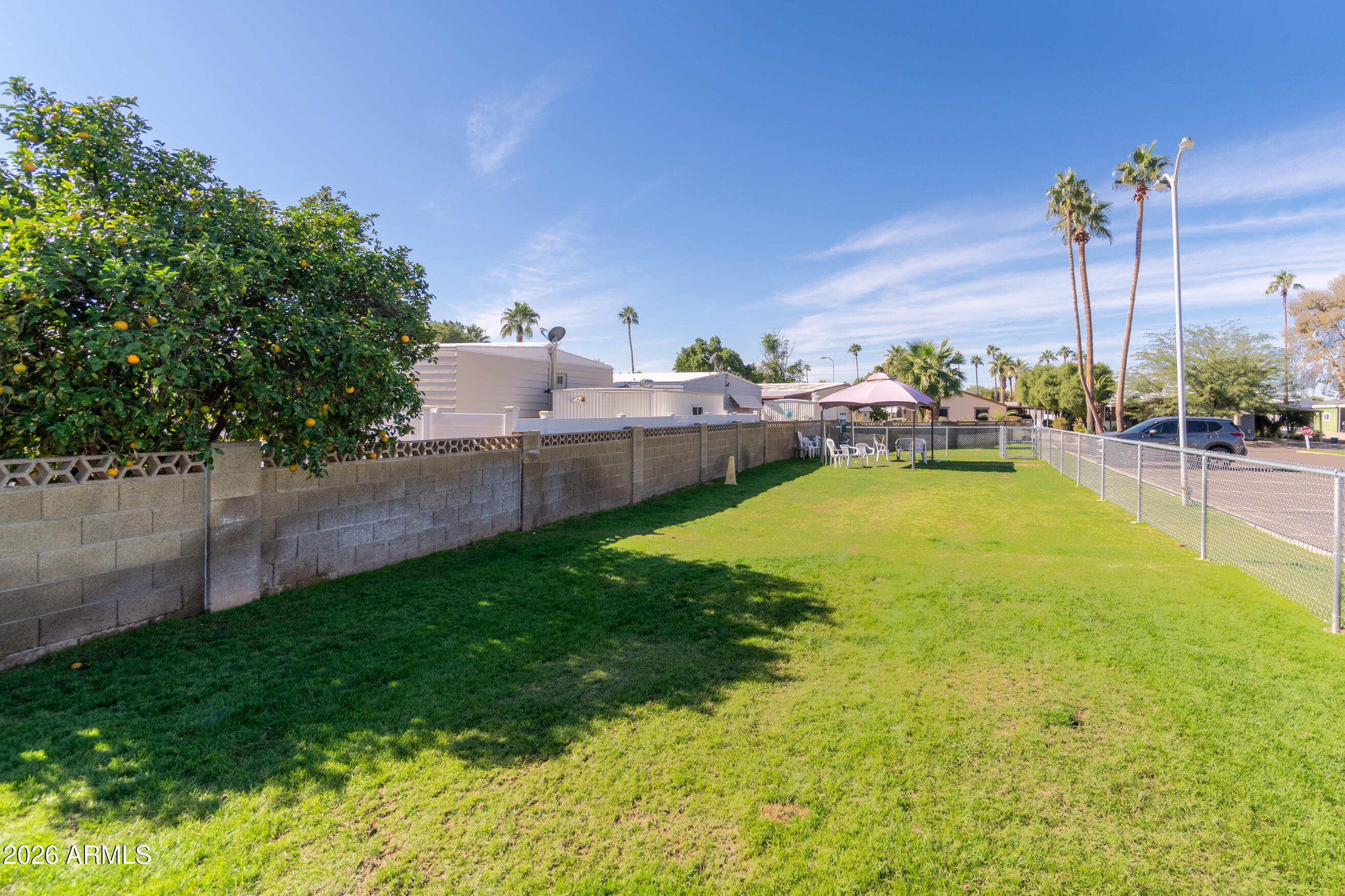 201 South Greenfield Road, Unit 361 Mesa, AZ 85206 - Photo 38 of 53 a view of a swimming pool and a yard