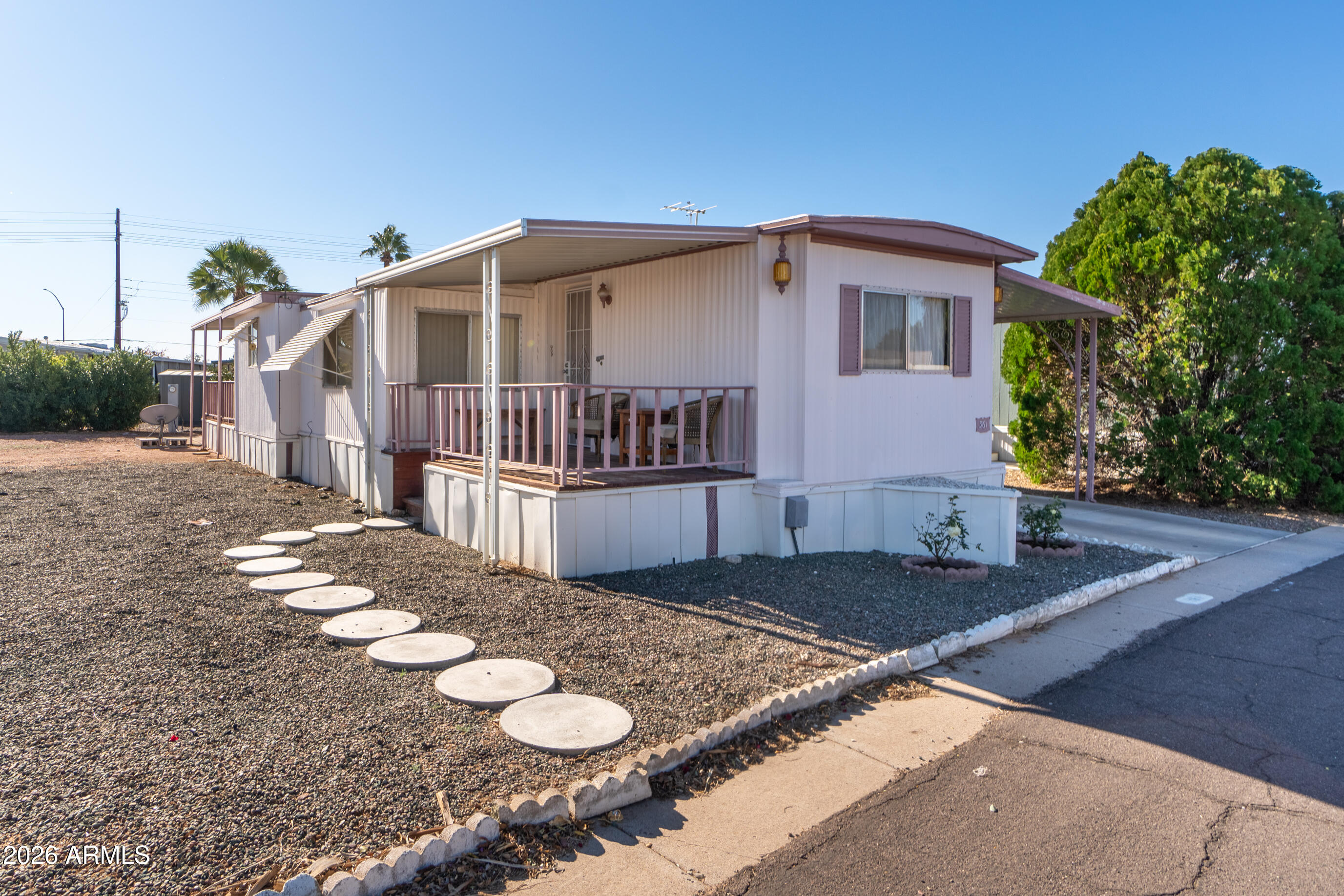 201 South Greenfield Road, Unit 361 Mesa, AZ 85206 - Photo 4 of 53 a front view of a house with yard