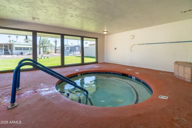 a room with pool tables and windows