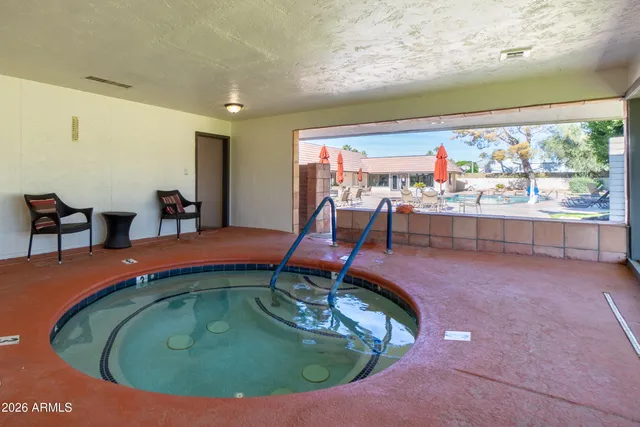 a kitchen with stainless steel appliances kitchen island granite countertop furniture and a dining table