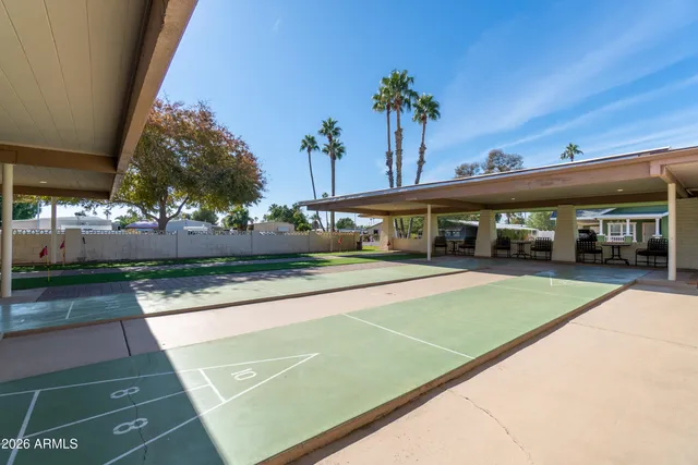 a view of a swimming pool with a patio