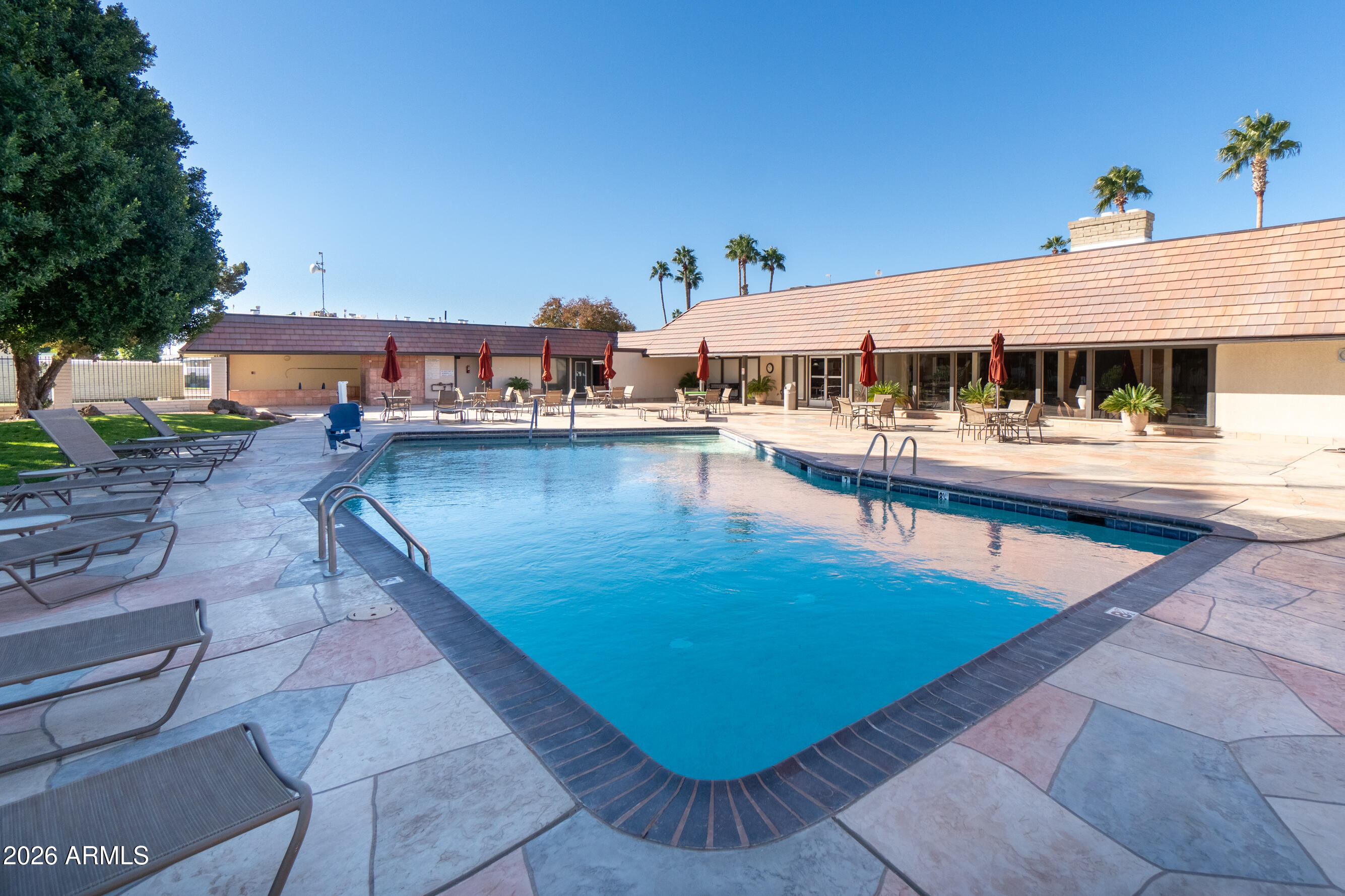 201 South Greenfield Road, Unit 361 Mesa, AZ 85206 - Photo 51 of 53 a view of a swimming pool with a patio