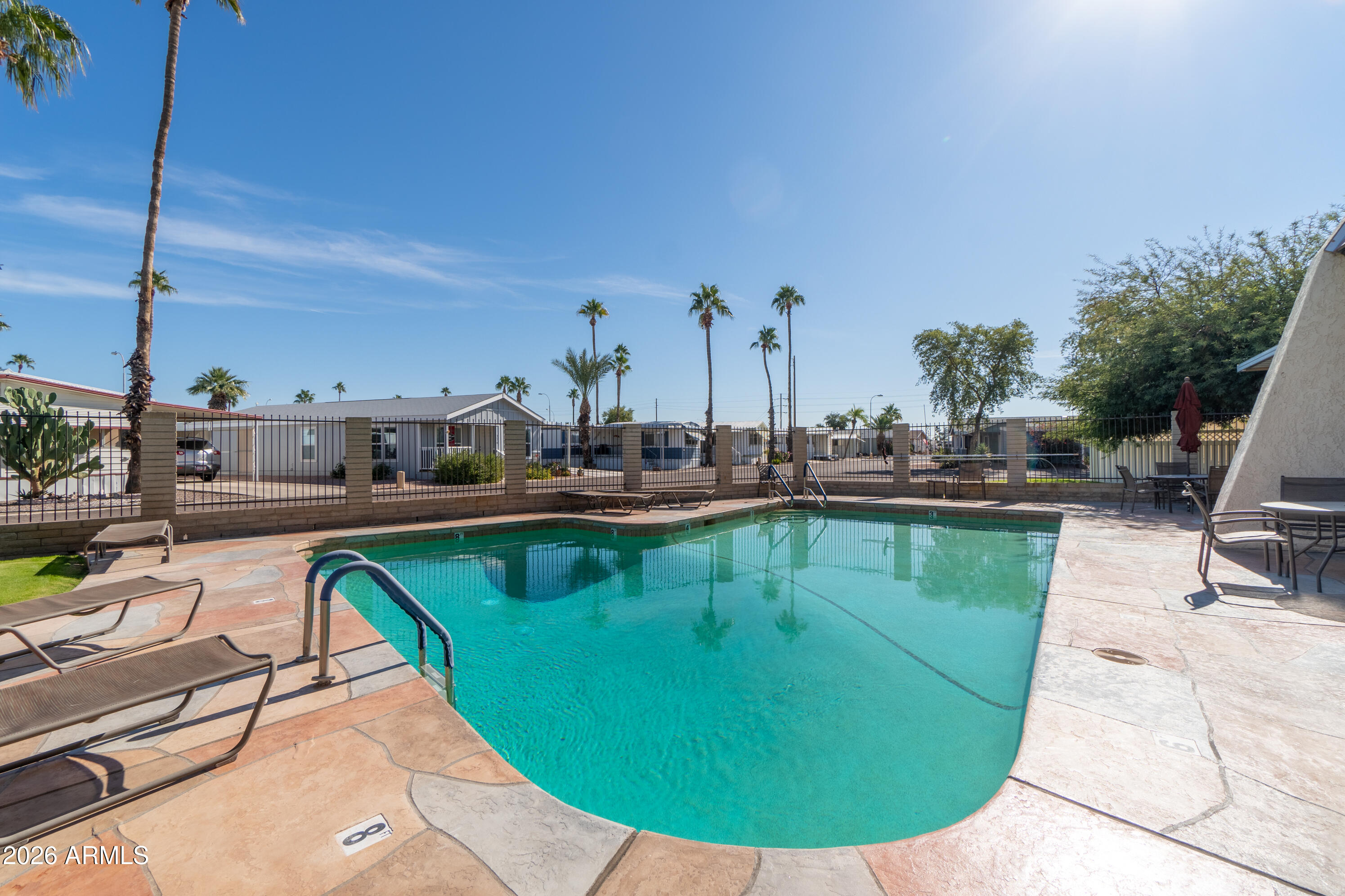 201 South Greenfield Road, Unit 361 Mesa, AZ 85206 - Photo 52 of 53 a view of a swimming pool with outdoor seating