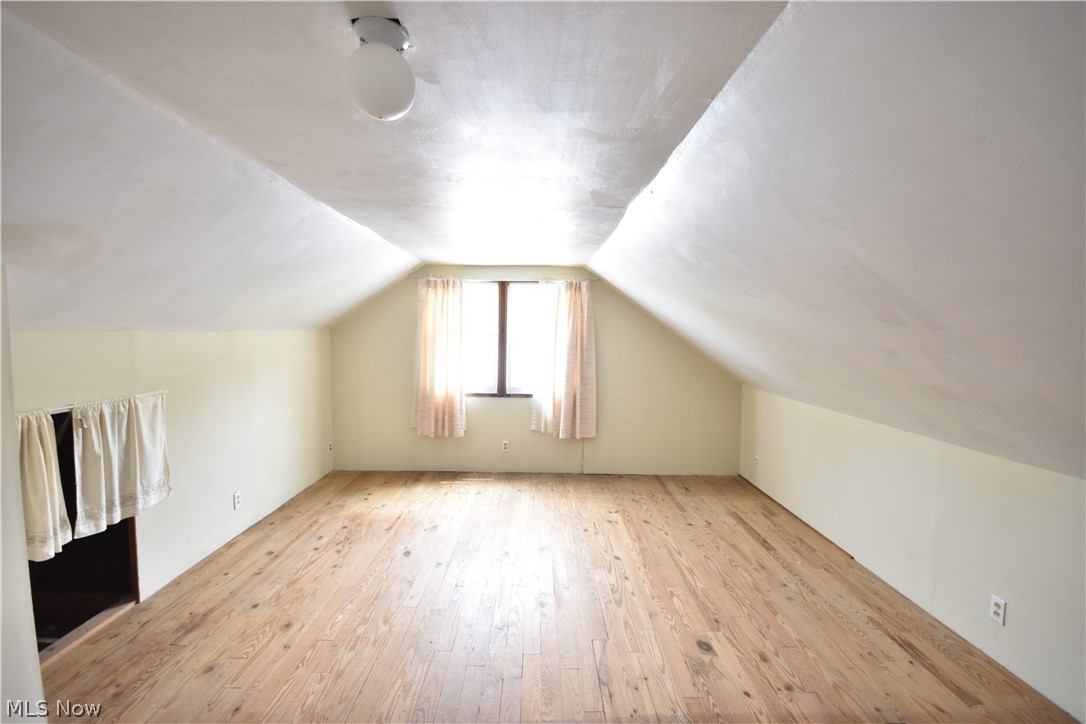 31921 Pendley Road Willowick, OH 44095 - Photo 19 of 22 Additional living space with light hardwood / wood-style floors and lofted ceiling