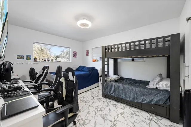 a bed room with furniture and a window