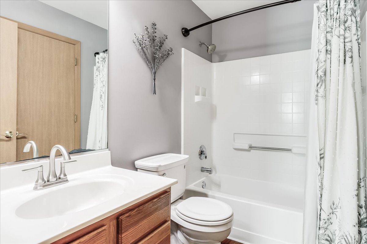 600 Spring Drive Marengo, IL 60152 - Photo 12 of 28 a bathroom with a sink toilet vanity and shower