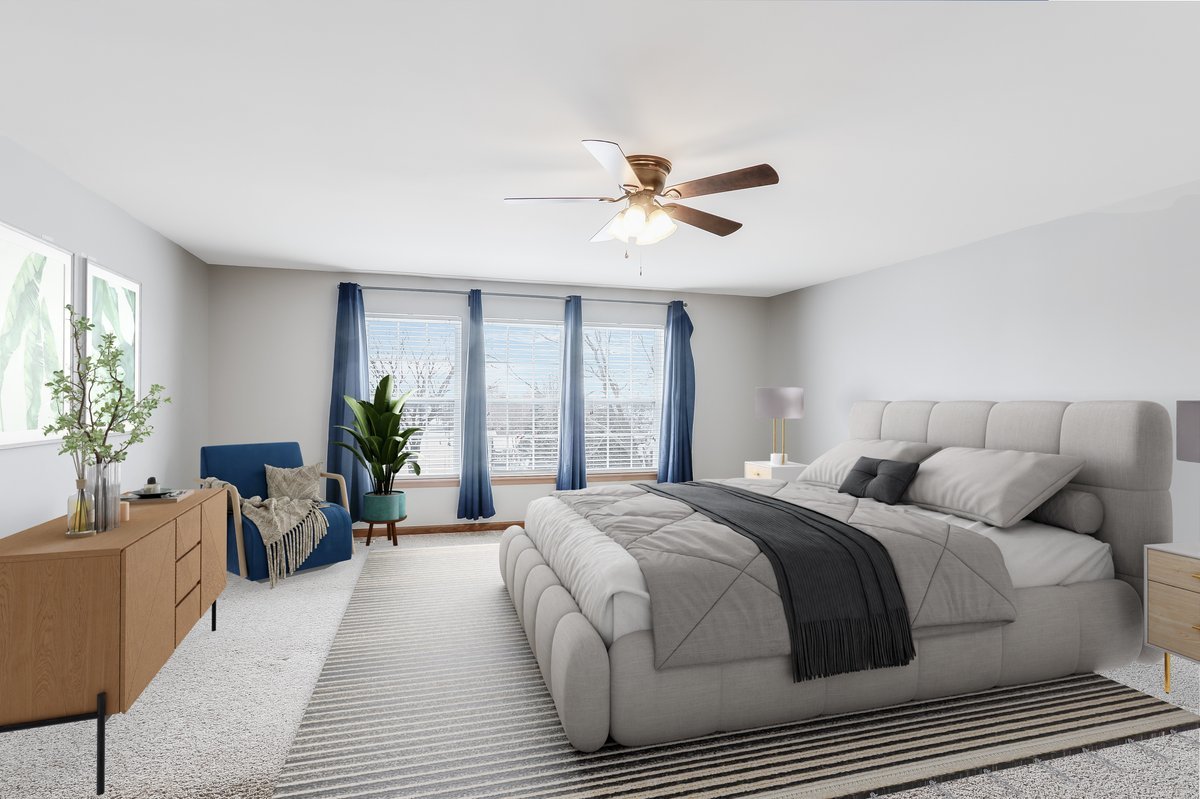 600 Spring Drive Marengo, IL 60152 - Photo 15 of 28 a spacious bedroom with a large bed and a chandelier