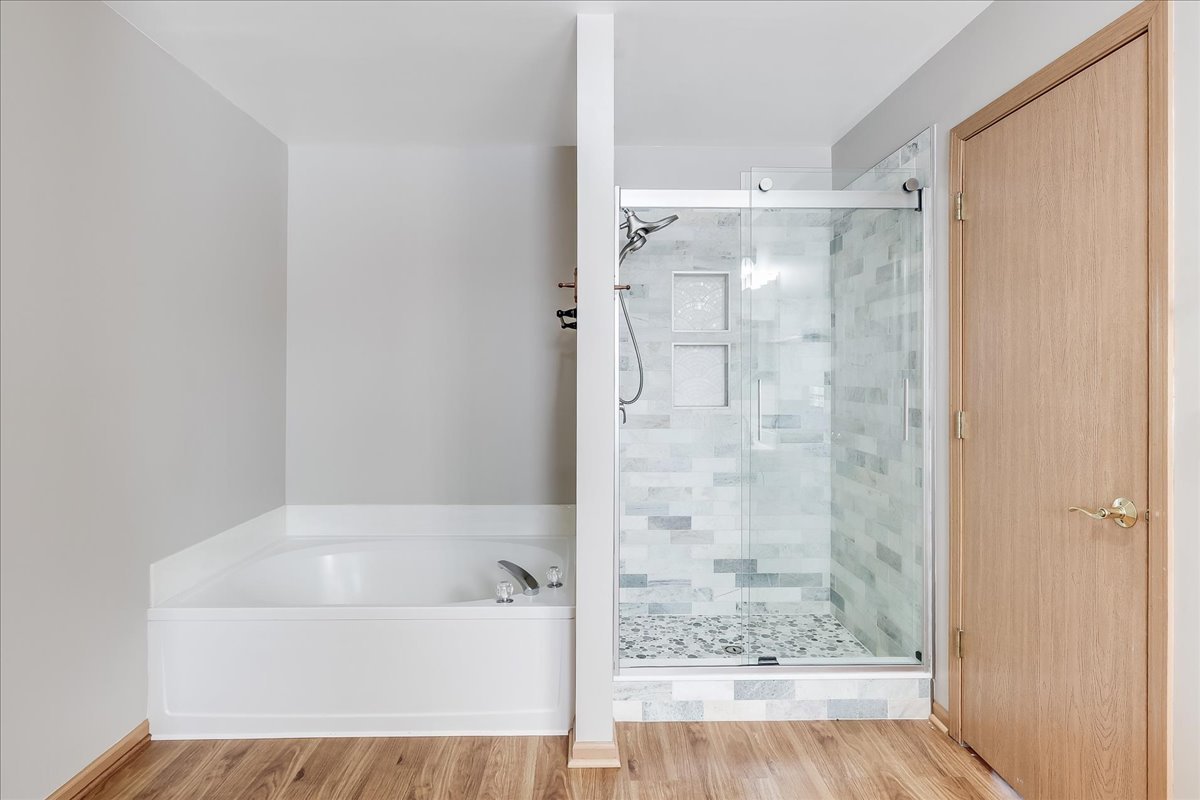 600 Spring Drive Marengo, IL 60152 - Photo 19 of 28 a bathroom with a bathtub and shower