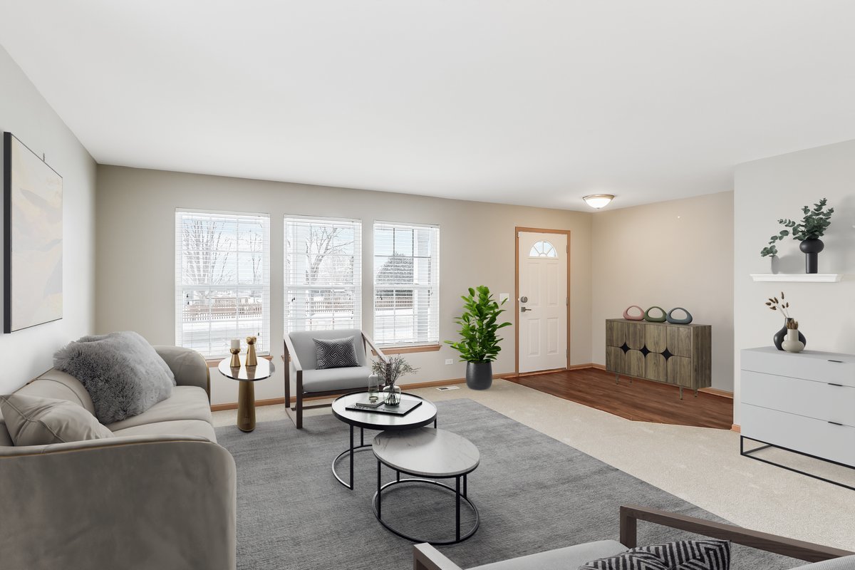 600 Spring Drive Marengo, IL 60152 - Photo 2 of 28 a living room with furniture and a large window