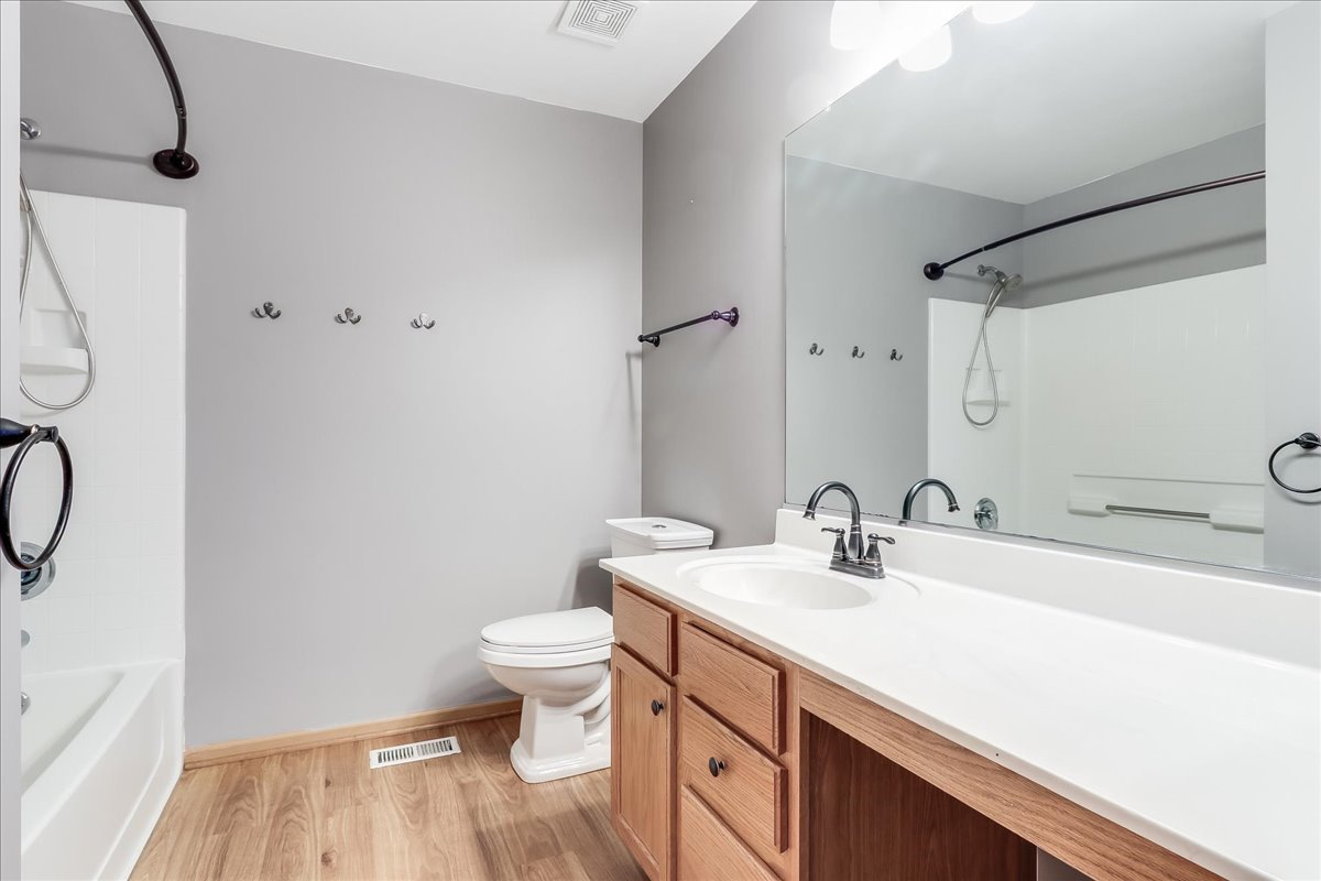 600 Spring Drive Marengo, IL 60152 - Photo 23 of 28 a bathroom with a sink a toilet and a mirror