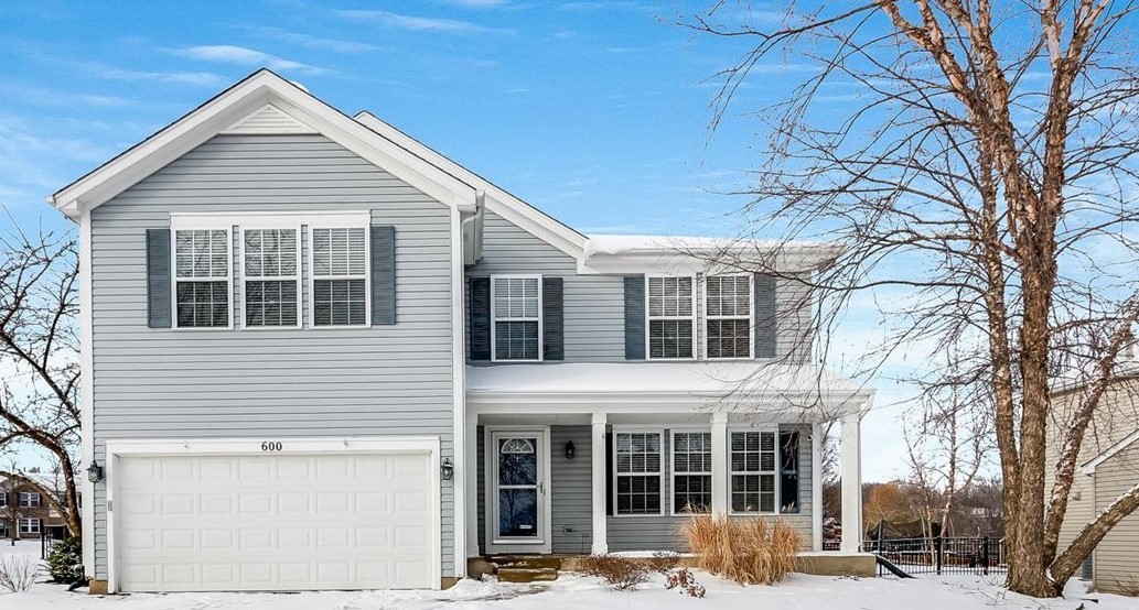 600 Spring Drive Marengo, IL 60152 - Photo 28 of 28 a front view of a house with a yard