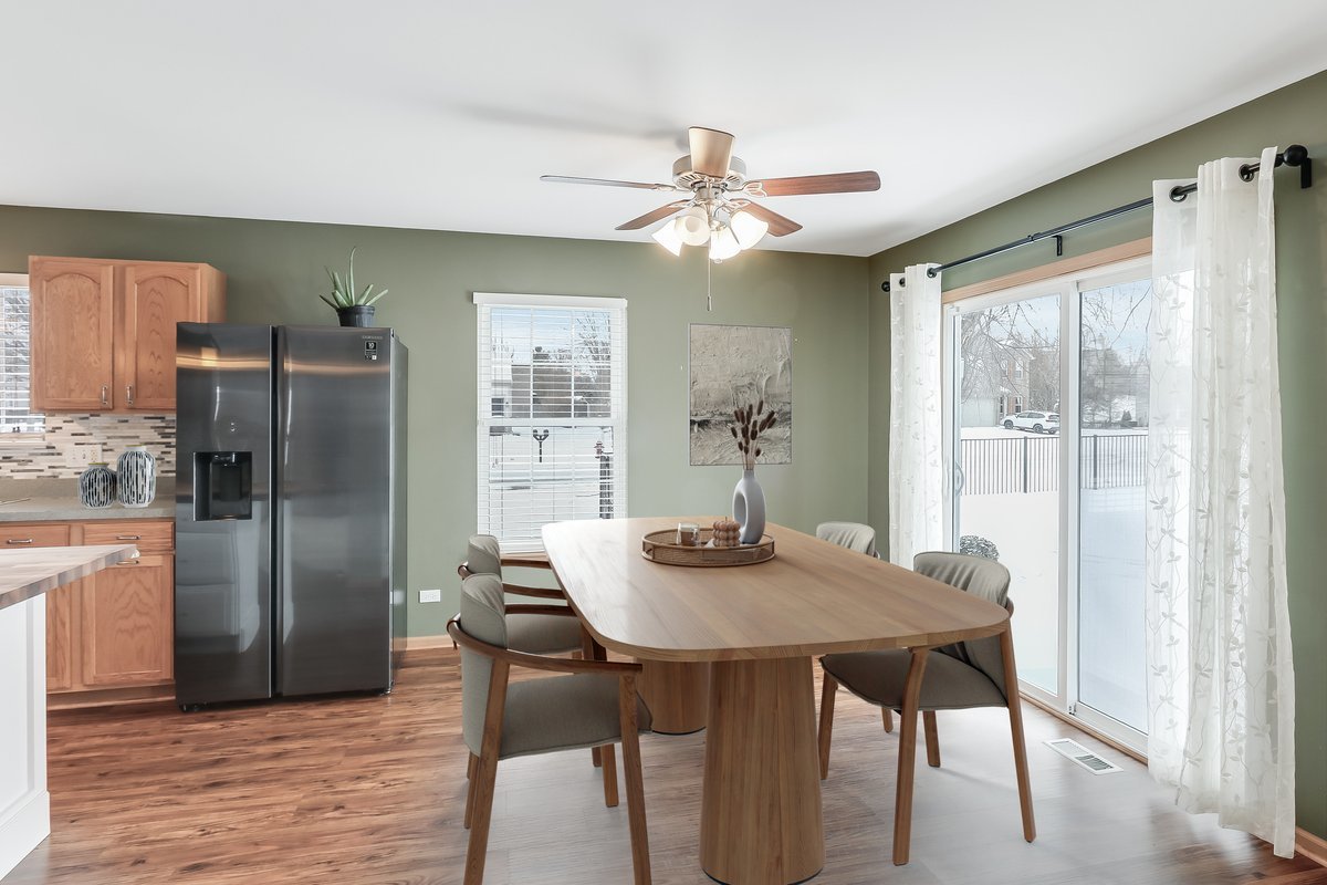 600 Spring Drive Marengo, IL 60152 - Photo 6 of 28 a view of a dining room with furniture window and wooden floor