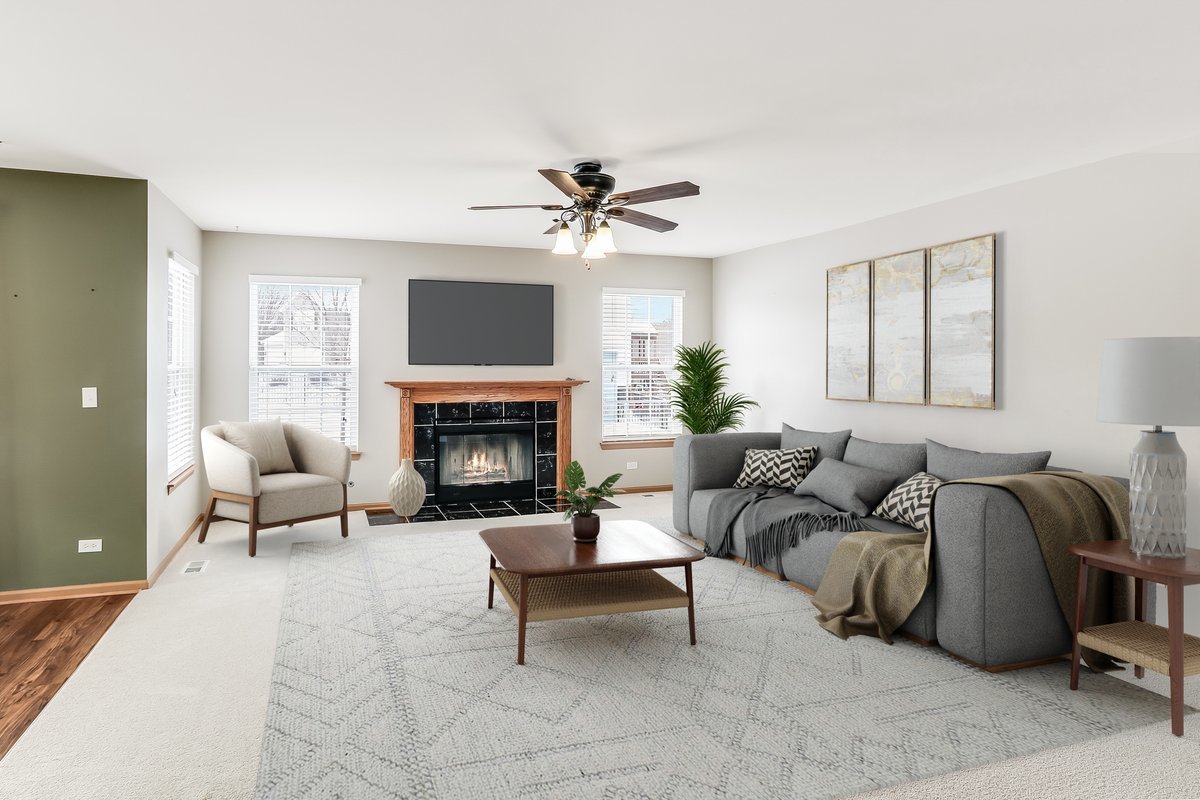 600 Spring Drive Marengo, IL 60152 - Photo 8 of 28 a living room with furniture a flat screen tv and a fireplace