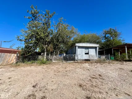 a house view with a backyard space