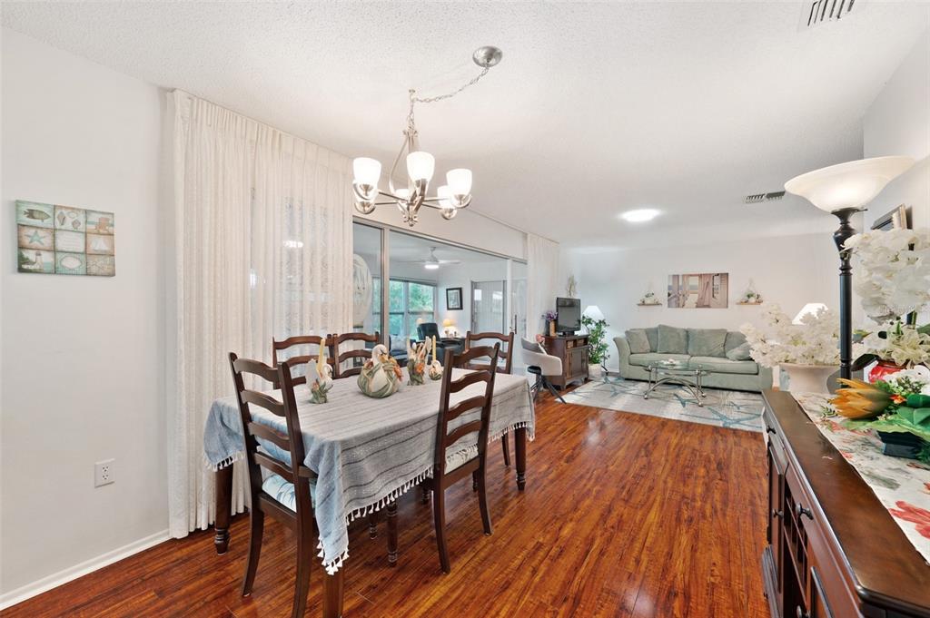 4659 Coachmen Road New Port Richey, FL 34655 - Photo 7 of 40 Dining Room overlooks the Living Room and Florida Room