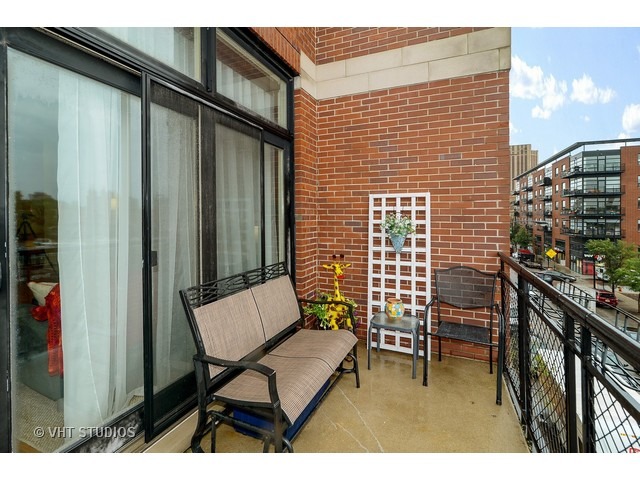 2089 West Wabansia Avenue, Unit 306 Chicago, IL 60647 - Photo 12 of 12 a balcony with chairs and with outdoor views