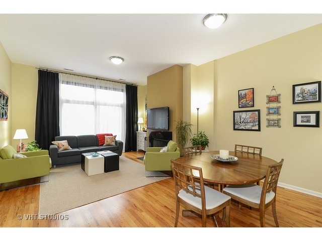 2089 West Wabansia Avenue, Unit 306 Chicago, IL 60647 - Photo 3 of 12 a living room with furniture and a window
