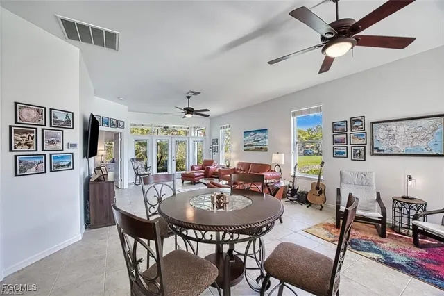 a view of a dining room with furniture and a livingroom