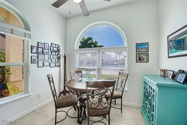 a view of a dining room with furniture window and outside view