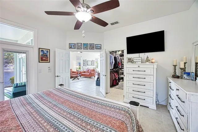 a bedroom with furniture and flat screen tv