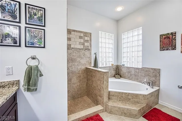 a bath tub sitting next to a bathroom sink