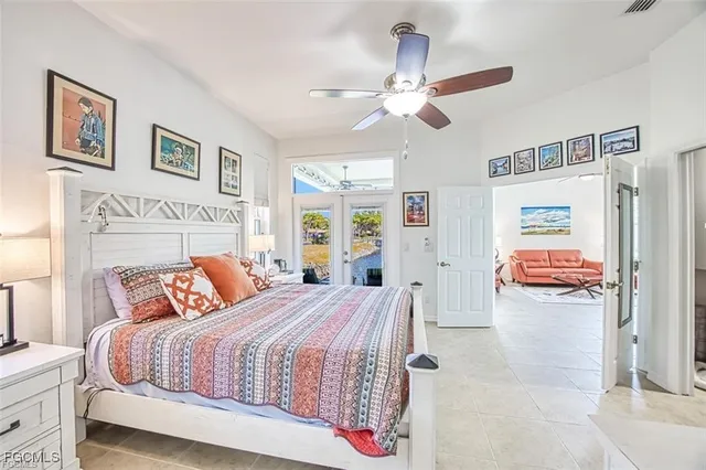 a bedroom with a bed and a large mirror