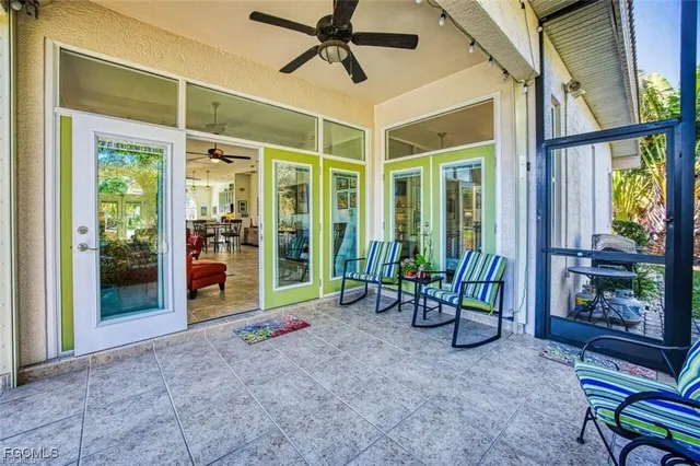 a view of an entryway with table in front of house