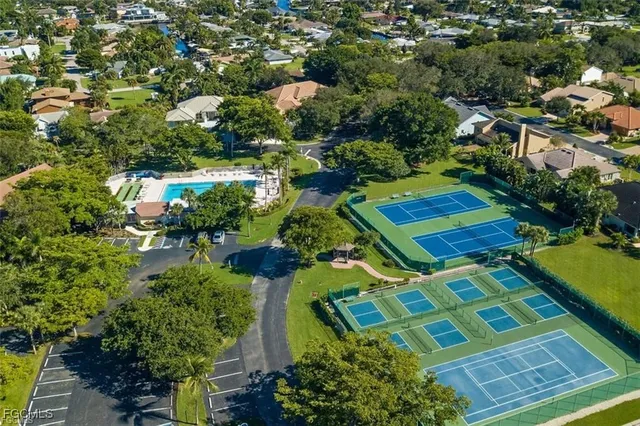 an aerial view of a residential houses with outdoor space
